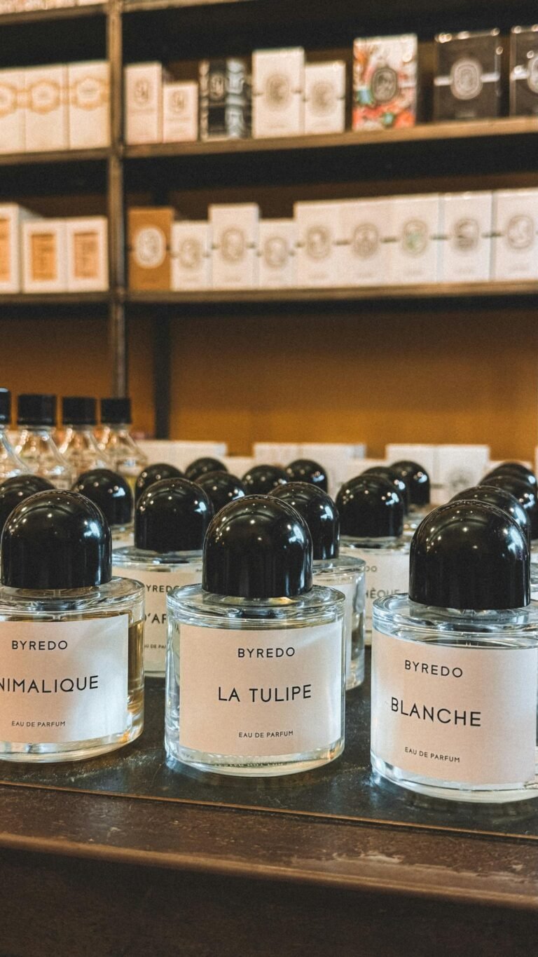 Elegant Byredo perfume bottles elegantly displayed in a Parisian store.